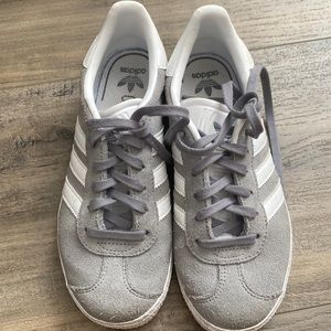 Grey and white adidas gazelle